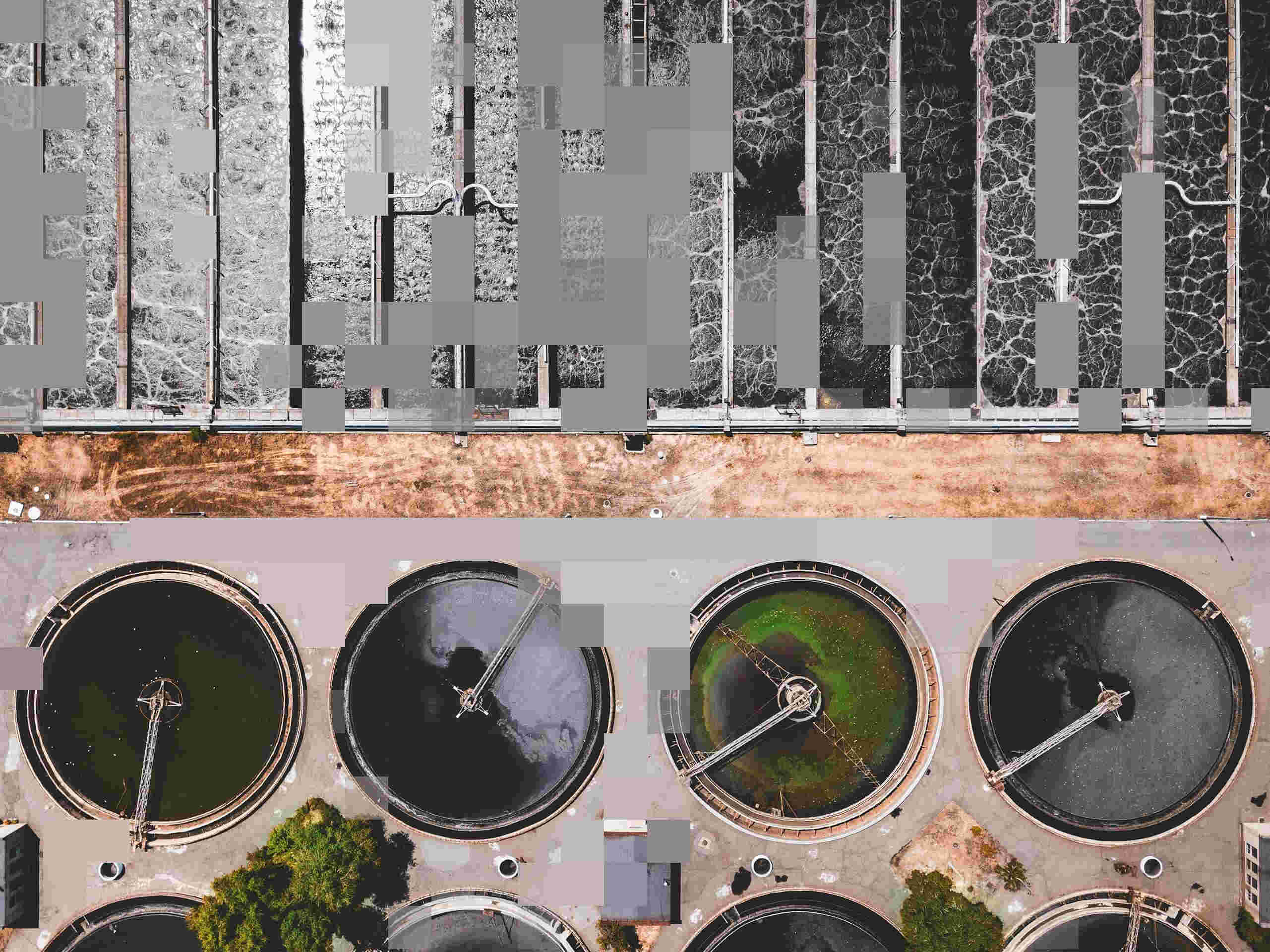 Aerial view of a wastewater treatment plant with circular settling tanks and rectangular aeration basins, overlaid with a pixel effect.