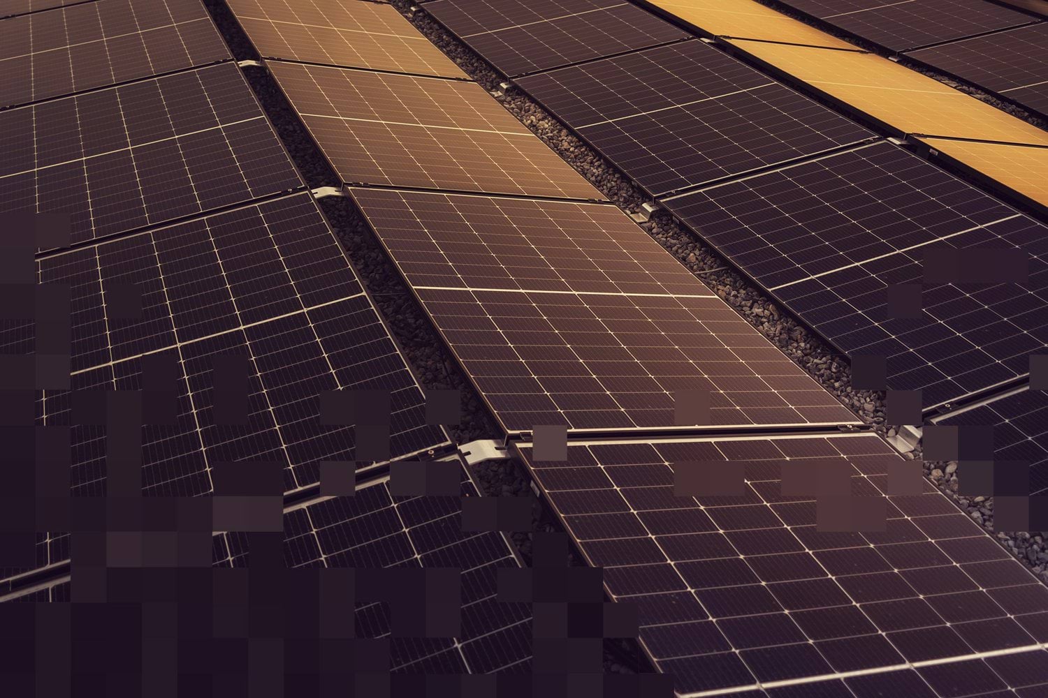 Aerial view of solar panels, illustrating the assessment of energy technologies and product environmental impacts across their life cycle.